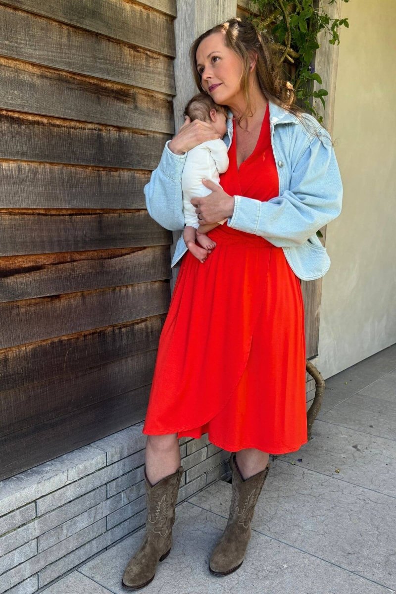 Harper Maternity & Nursing Dress - Simple Wishes - Red Flame - front view mom and baby lifestyle styled with boots