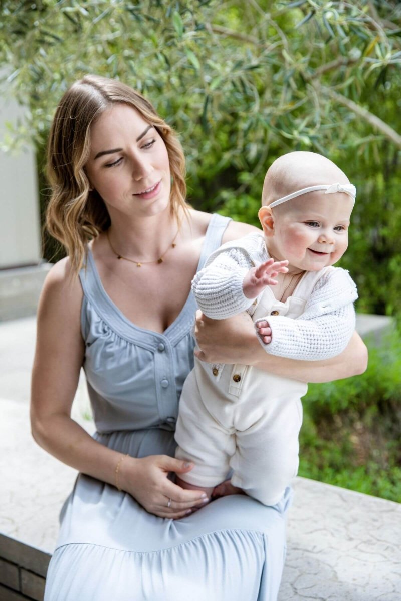 Lark Maternity and Nursing Dress in Ether front view seated button front detail mom and baby lifestyle