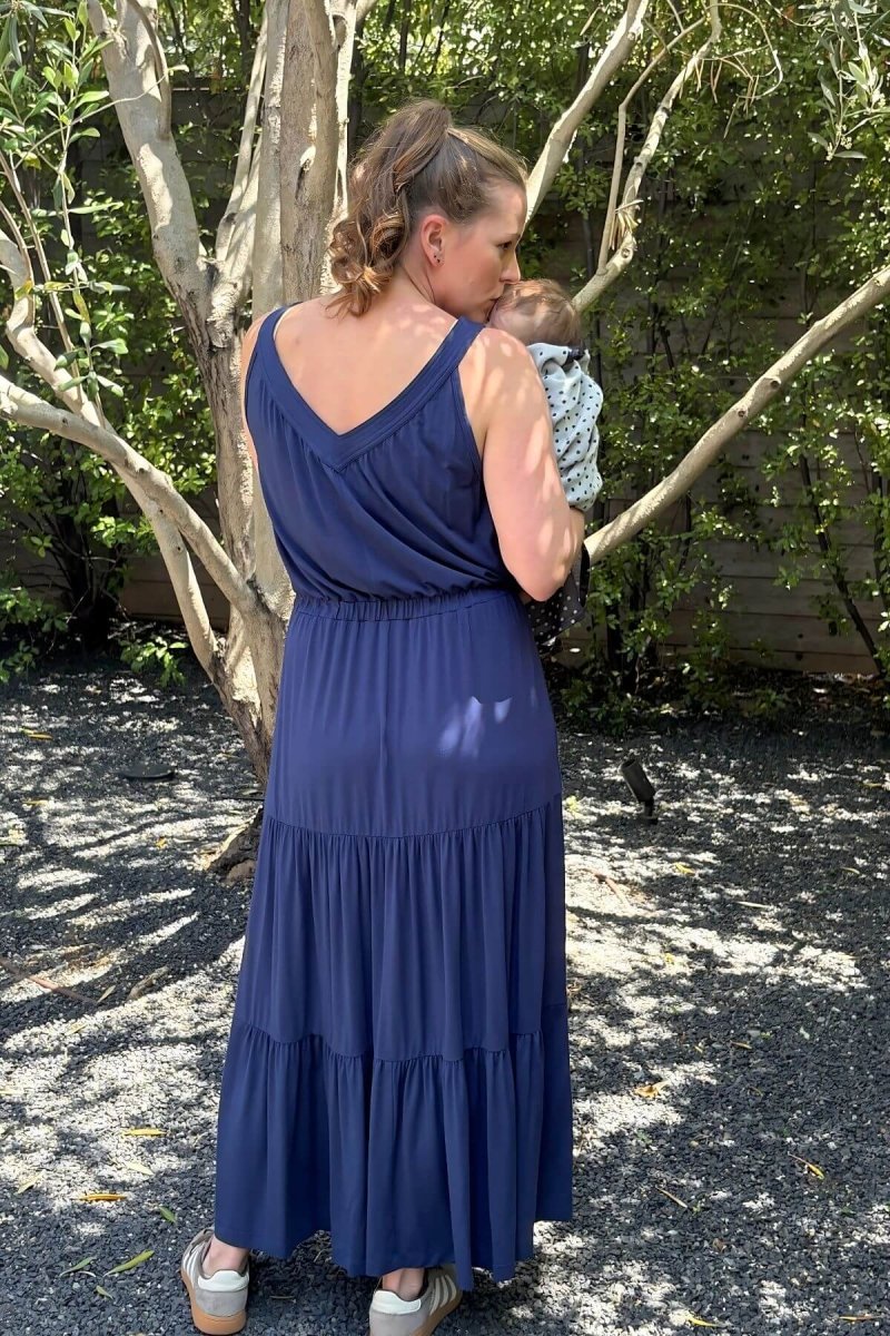 Lark Maternity and Nursing Dress in Indiigo back view full length lifestyle with baby