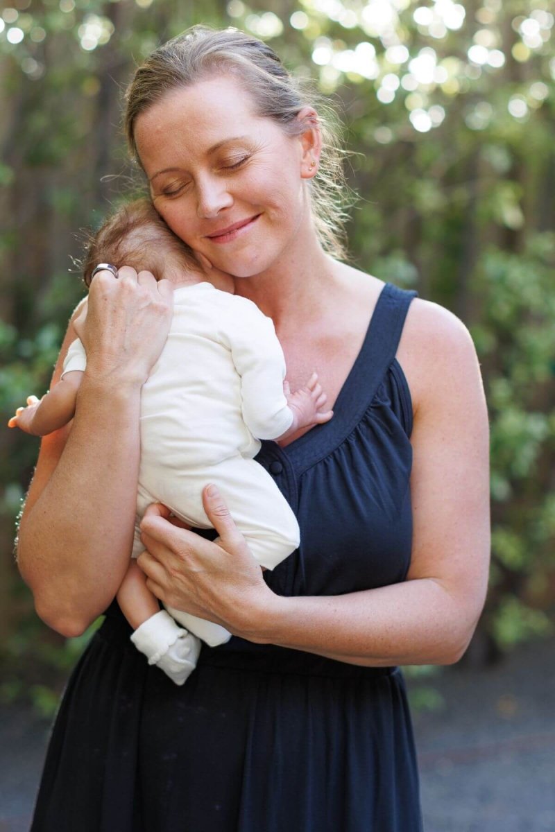Lark Maternity and Nursing Dress in Midnight front view mom and baby lifestyle