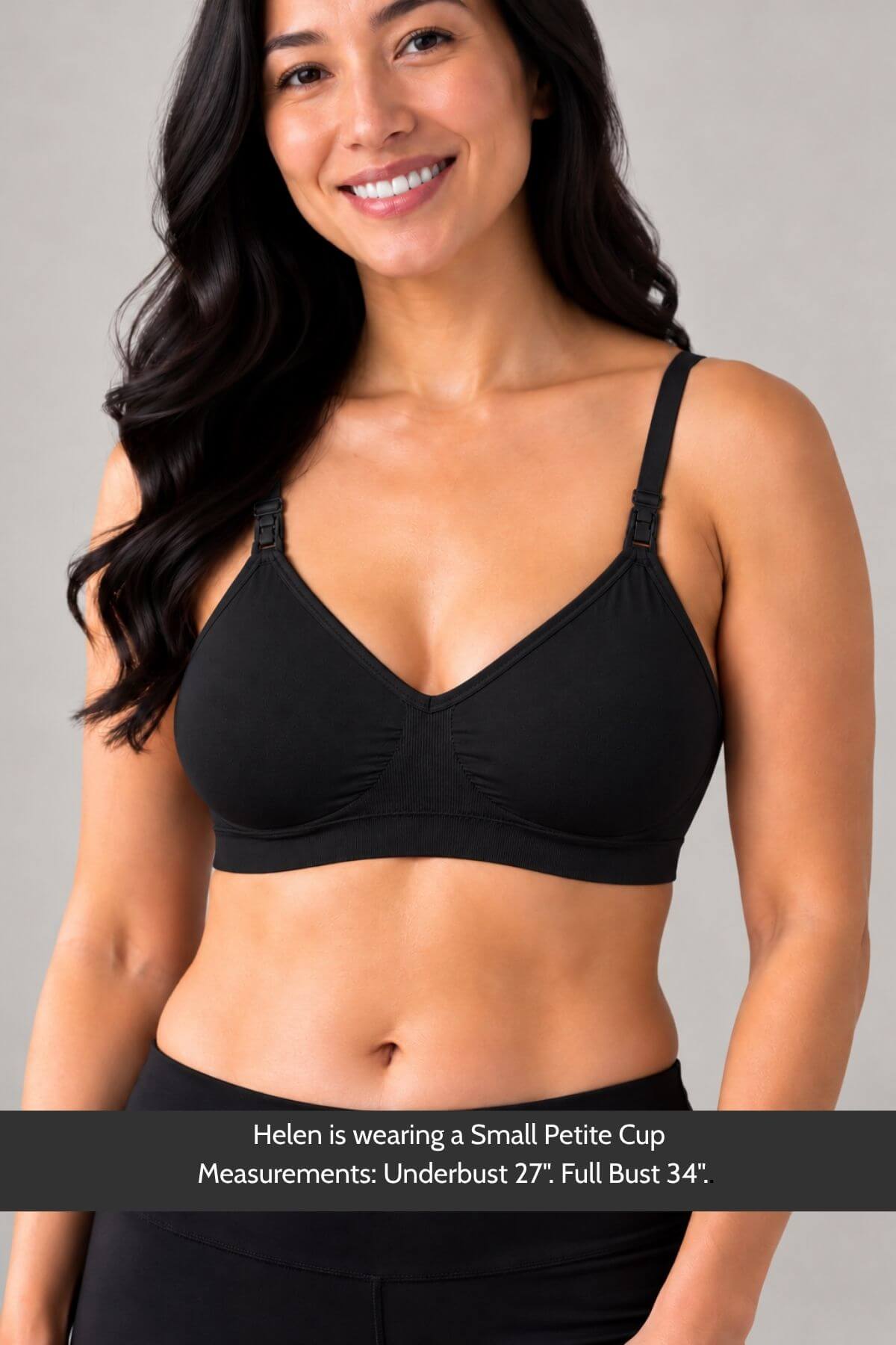 A woman wearing in a black simple wishes silhouette nursing & hands free pumping bra with a ribbed center detail and thin straps, shown against a light gray studio background with a text banner at the bottom detailing measurements.