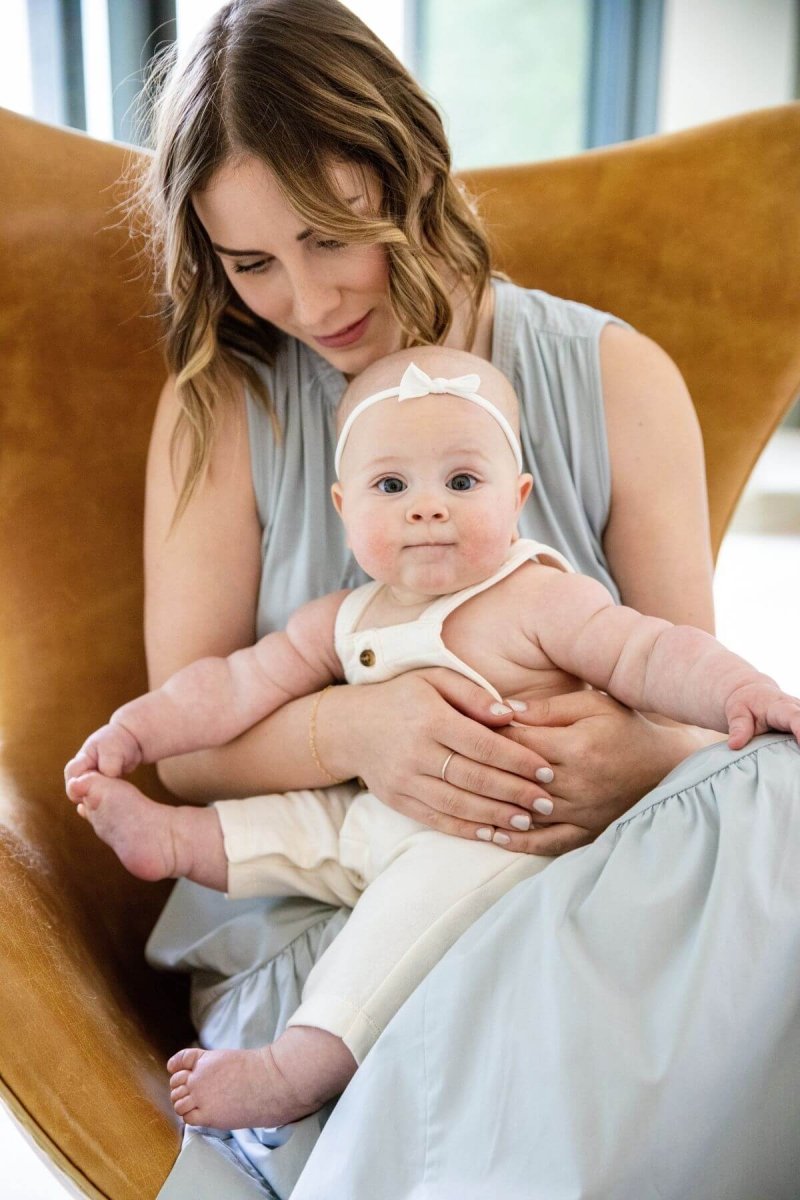 Willow Nursing Dress - Ether - Simple Wishes - seated front view mom and baby lifestyle