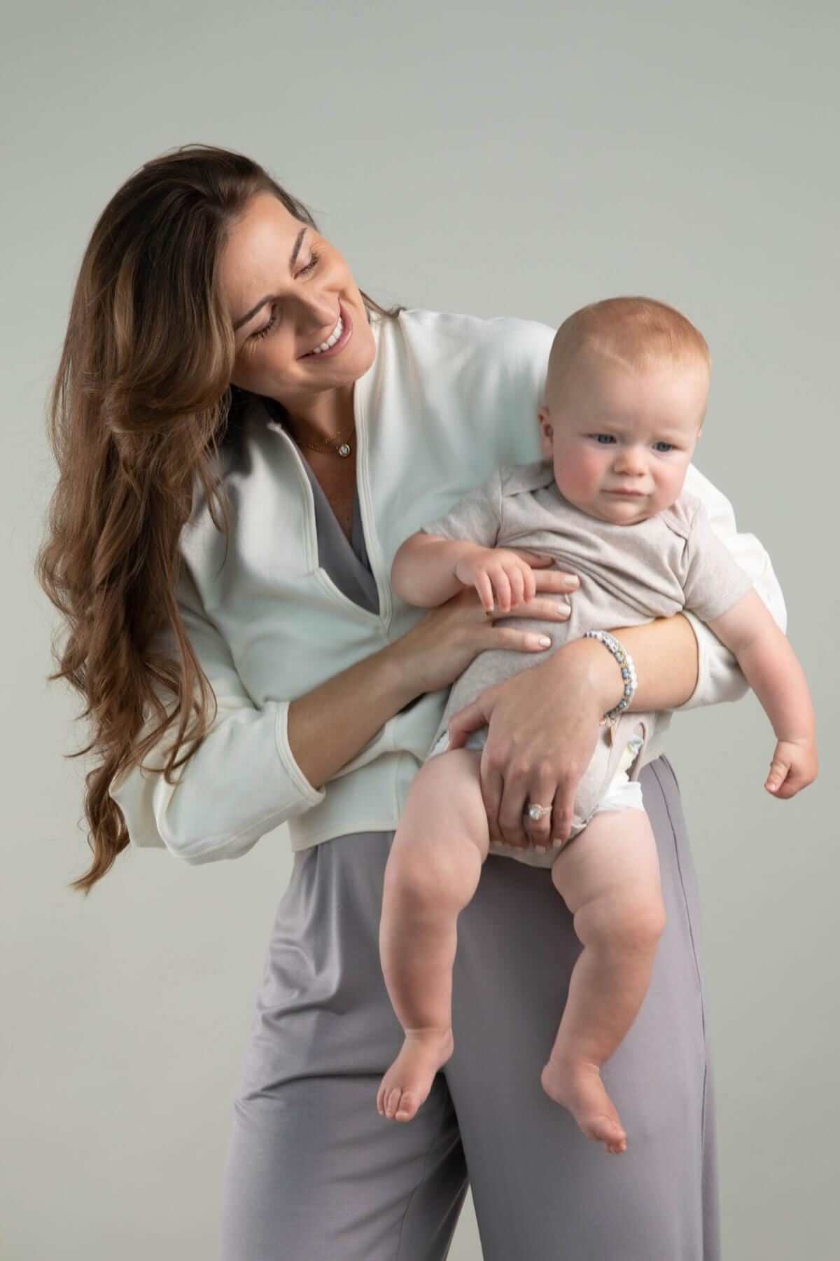 Aspen Breastfeeding Fleece Pullover front view deep v-neck with mom and baby