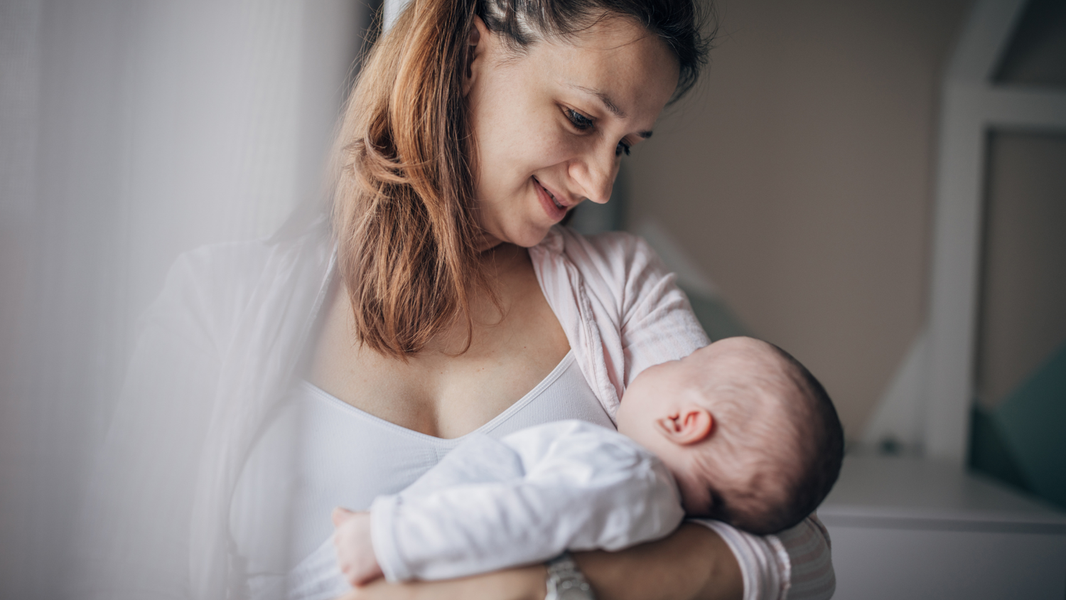 A First Time Mother Holding Her Child