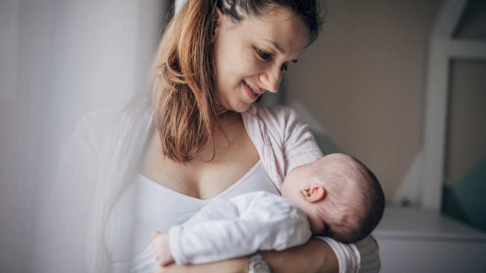 A First Time Mother Holding Her Child