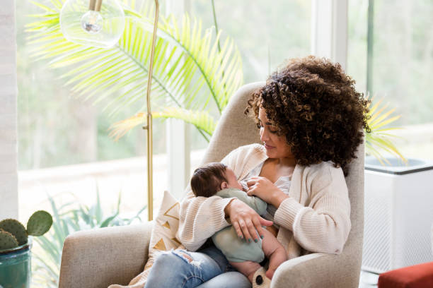 New Mom Nursing, Illustrating “Can You Breastfeed with Implants” in real life