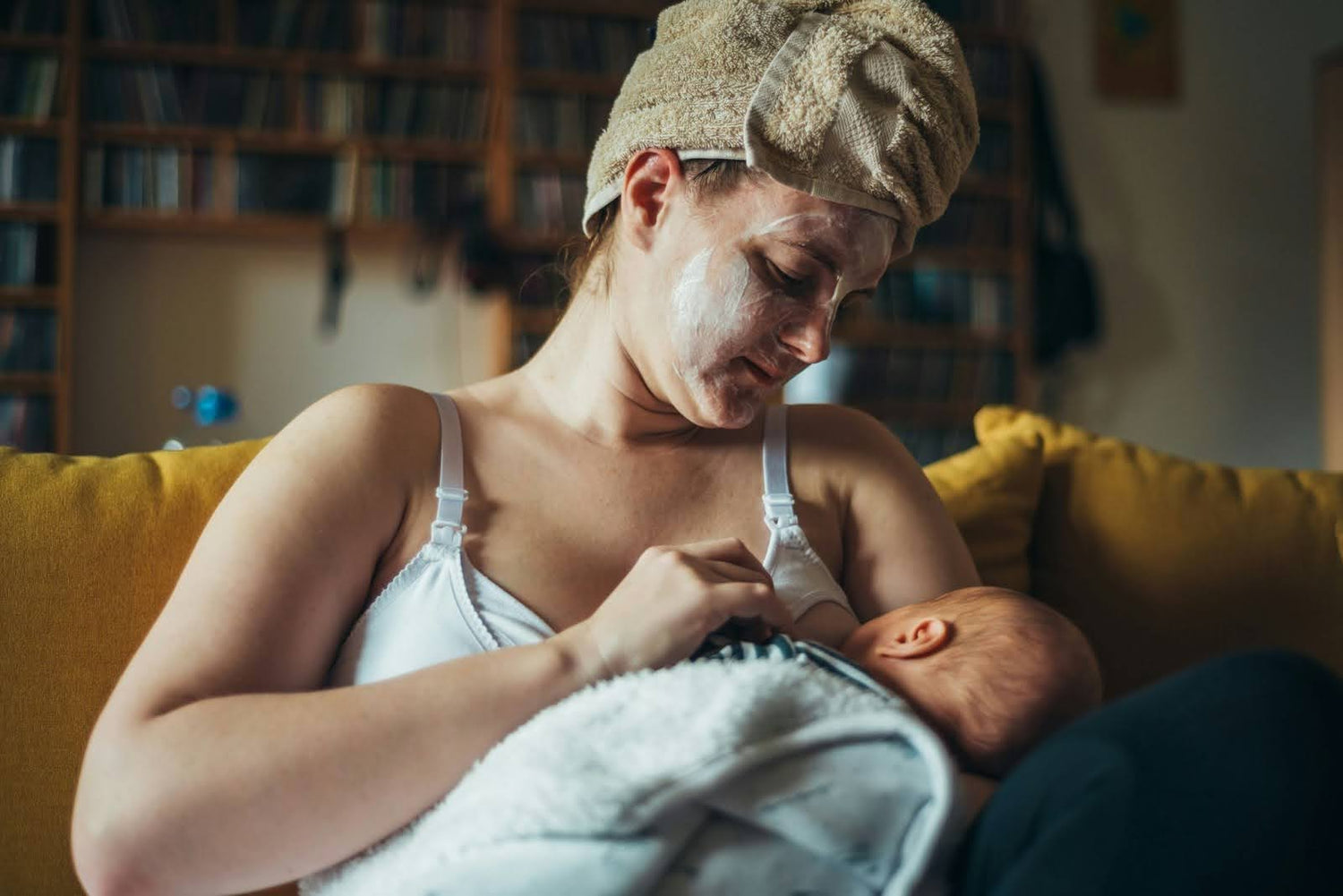 Pregnant Parent Gently Nursing A Toddler, Illustrating “Can You Breastfeed While Pregnant"