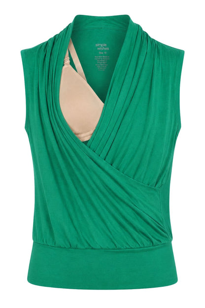 A green sleeveless wrap-style maternity top with a draped front and a beige nursing bra underneath, shown against a plain white background.