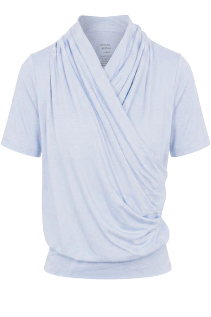 A light blue short-sleeve wrap top with a draped, cowl-like front overlay, shown on a plain white background.