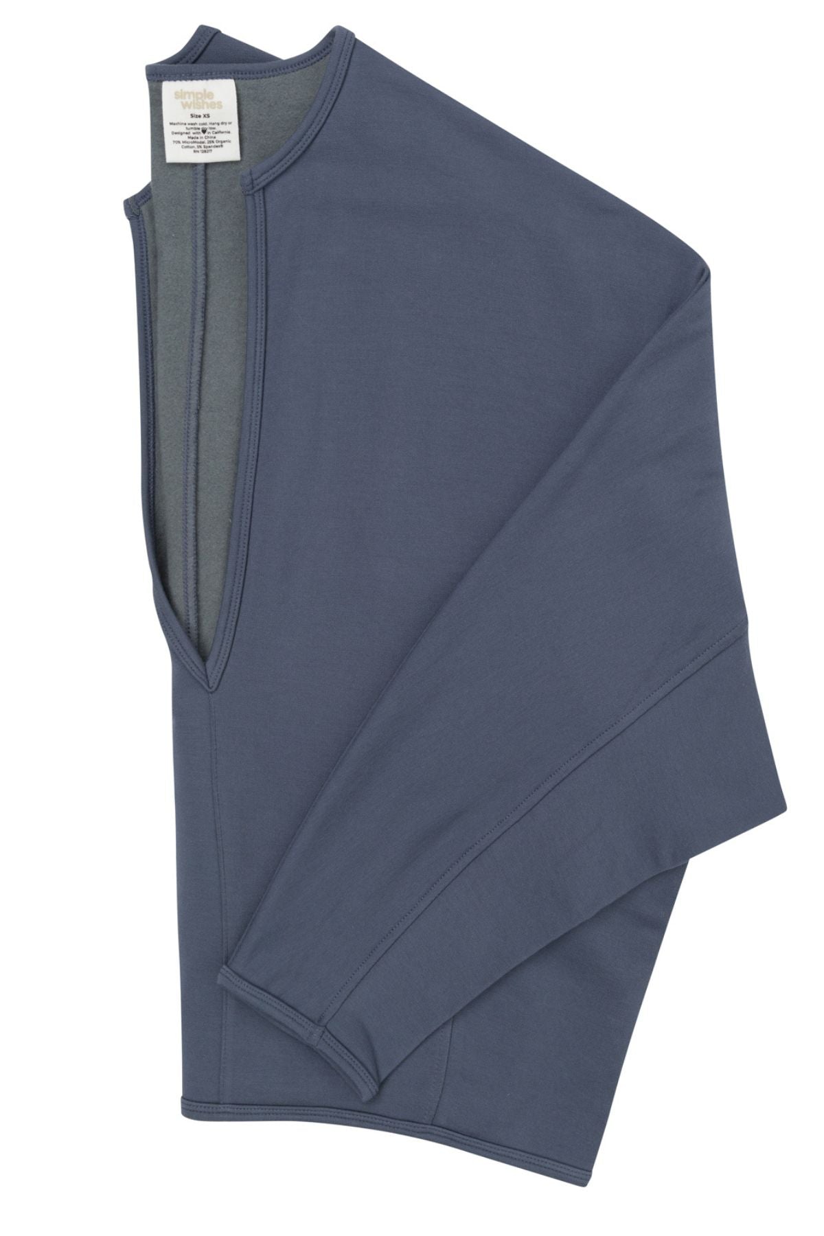 A folded slate blue long-sleeve top with a split V-neckline, shown on a plain white background.