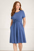 Woman wearing a dark blue nursing dress  for breastfeeding with functional pockets front view