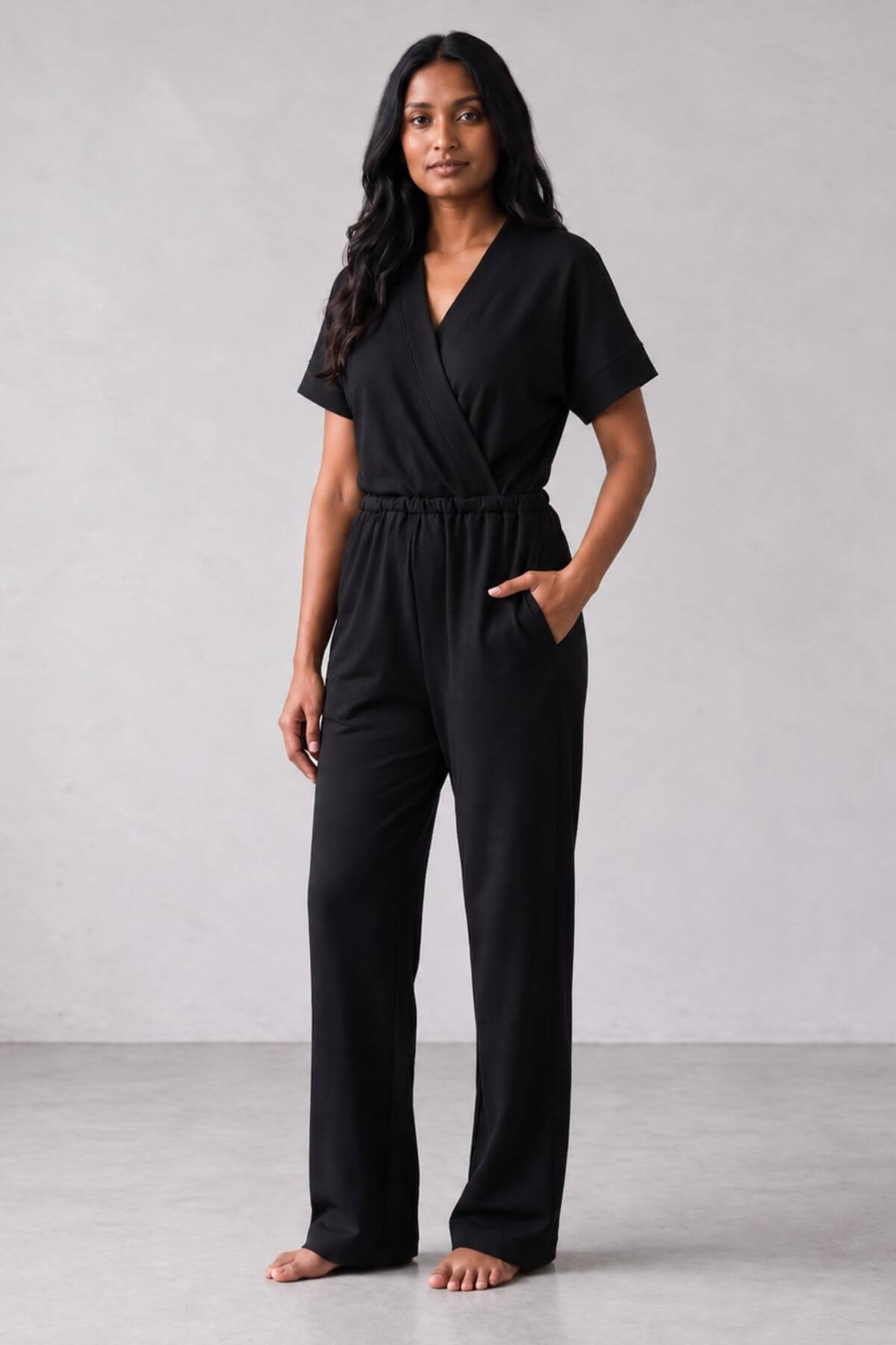 black nursing jumpsuit one-piece outfit in organic cotton modal spandex blend with brushed interior. color midnight black front view.