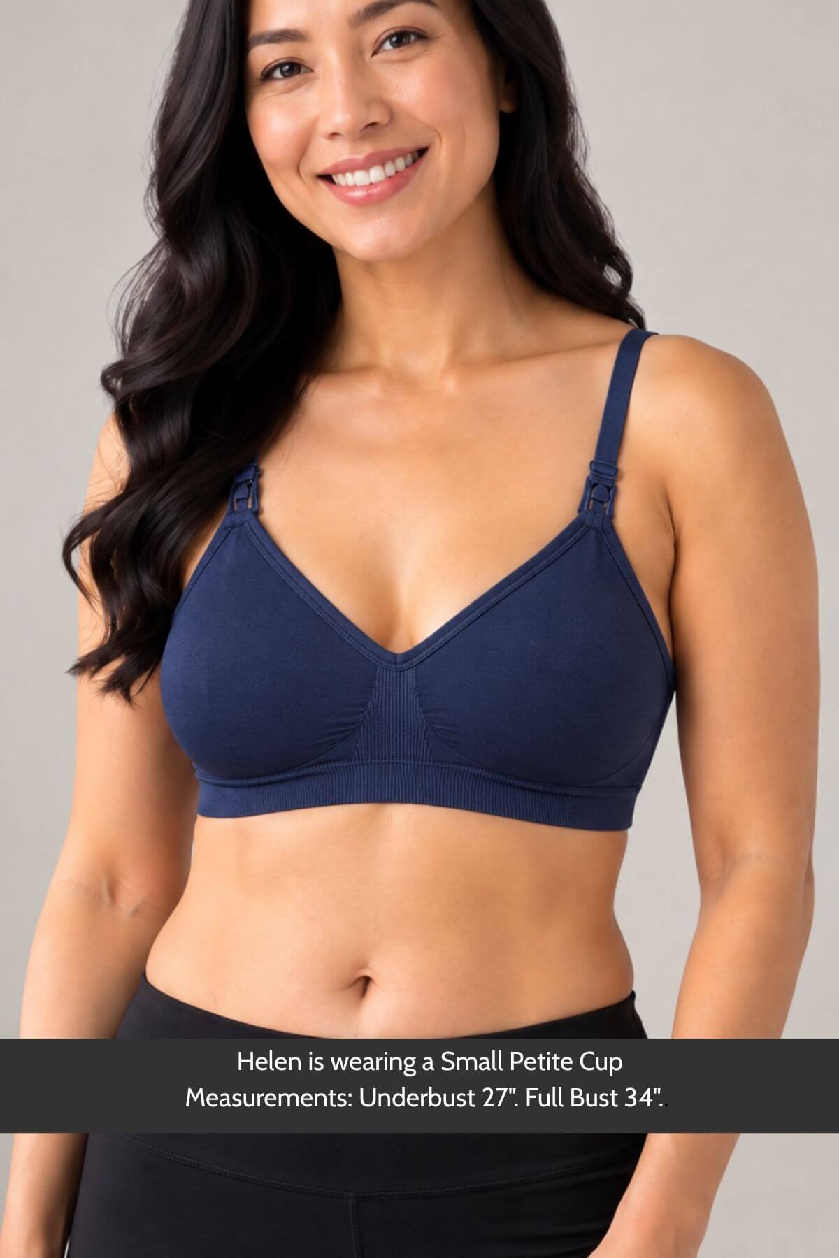 A woman wearing the Stages Nursing Bra, Maternity Bra, Wearable Pump Bra and Everyday Bra all-in-one in indigo shown from the waist up against a light gray studio background. A text banner at the bottom reads: &