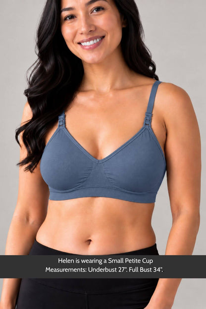 A smiling woman wearing a simple wishes supermom silhouette nursing bra and hands free pumping bra in maine blue with front adjustable shoulder straps, shown against a neutral gray background with a text overlay detailing measurements.