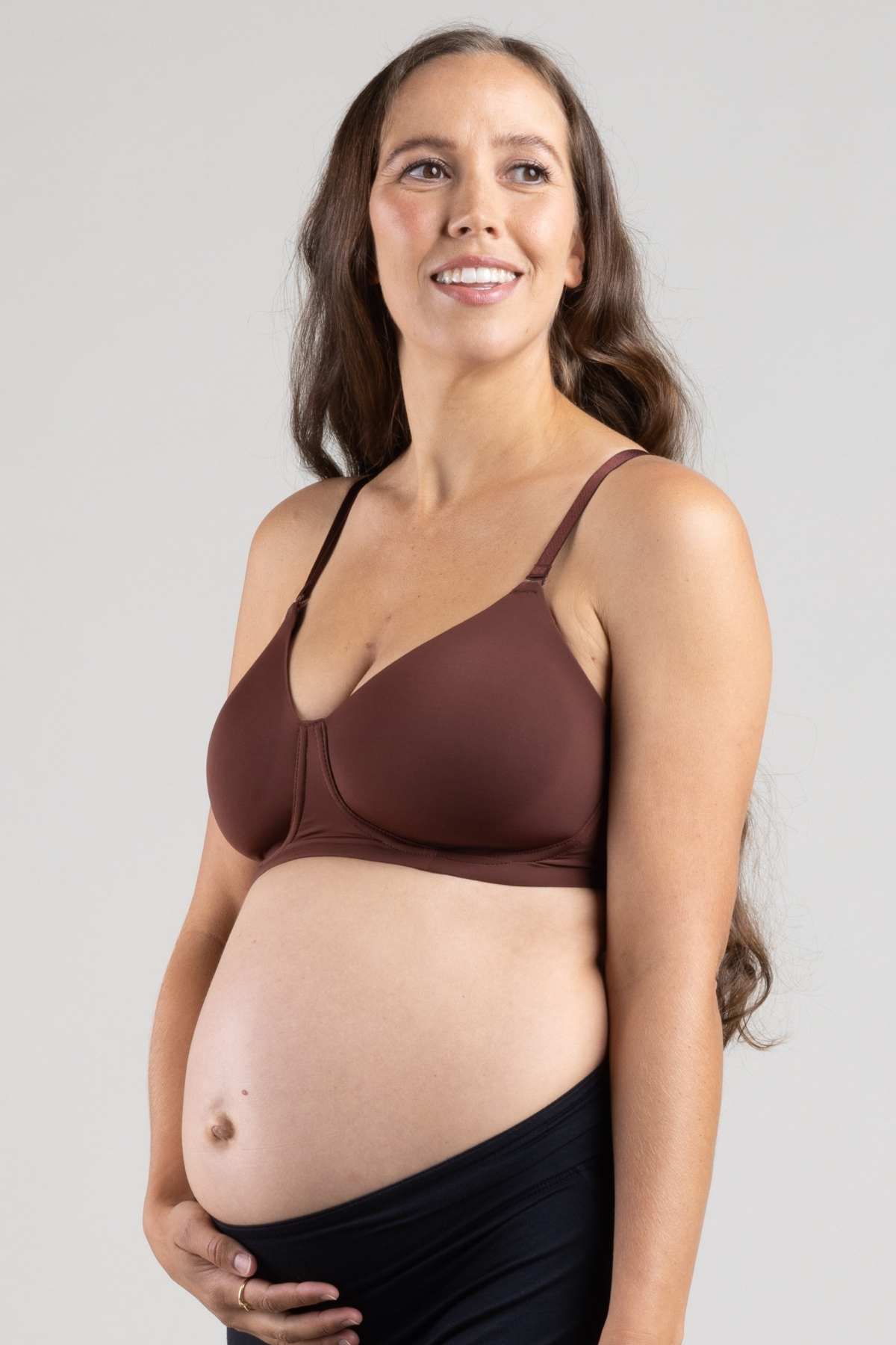 Undercover Nursing T-Shirt Bra worn on a pregnant woman in color bitter chocolate with the nursing clasp hidden for repurposed wear during pregnancy