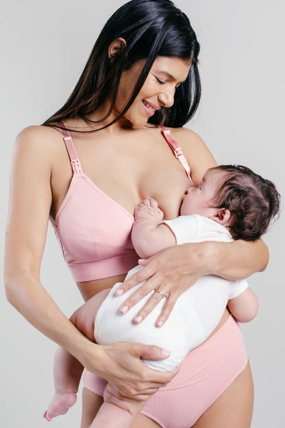SuperMom Skin-to-Skin Nursing &amp; Pumping Bra front view model breastfeeding baby in color rose pink